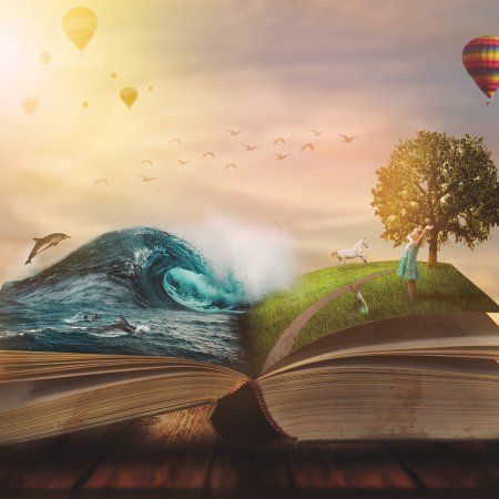 Concept of an open magic book; open pages with water and land an
